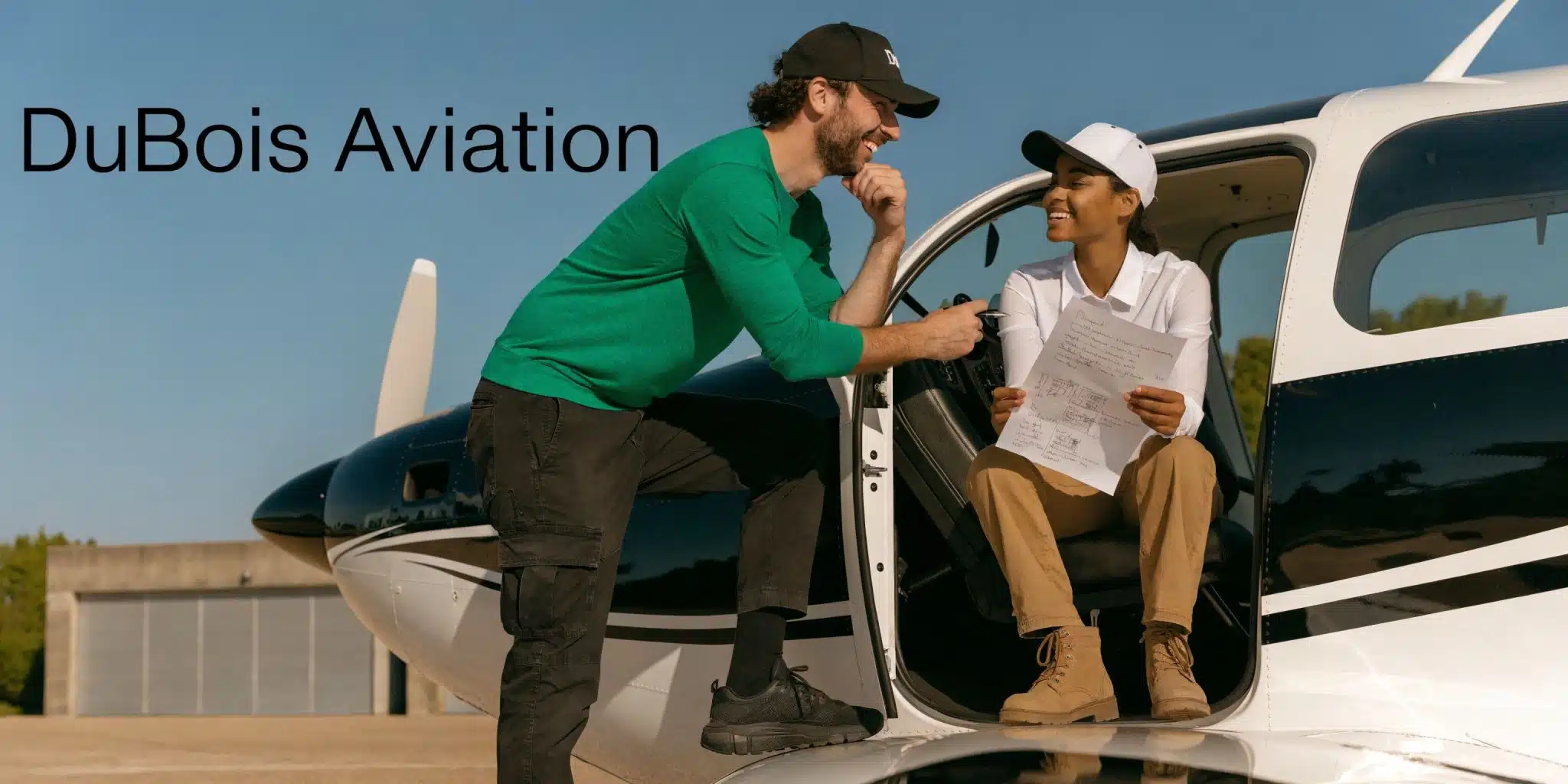 Flight Instructor Training Program: Your Career Launchpad 5 A flight instructor and student pilot reviewing flight documents together while standing by a private airplane.