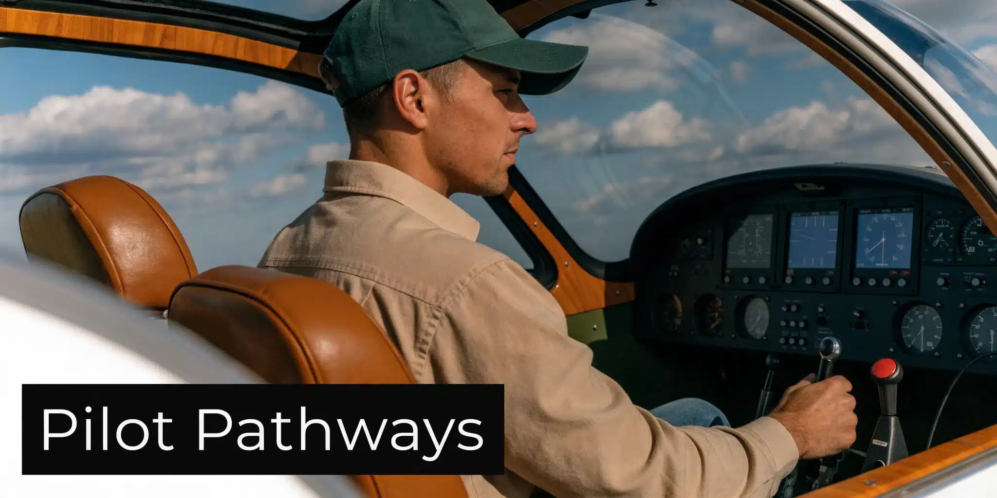 Flying Small Plane: Your 2026 Roadmap to the Sky 4 A young male pilot wearing a green cap and beige shirt sitting in the cockpit of an airplane.