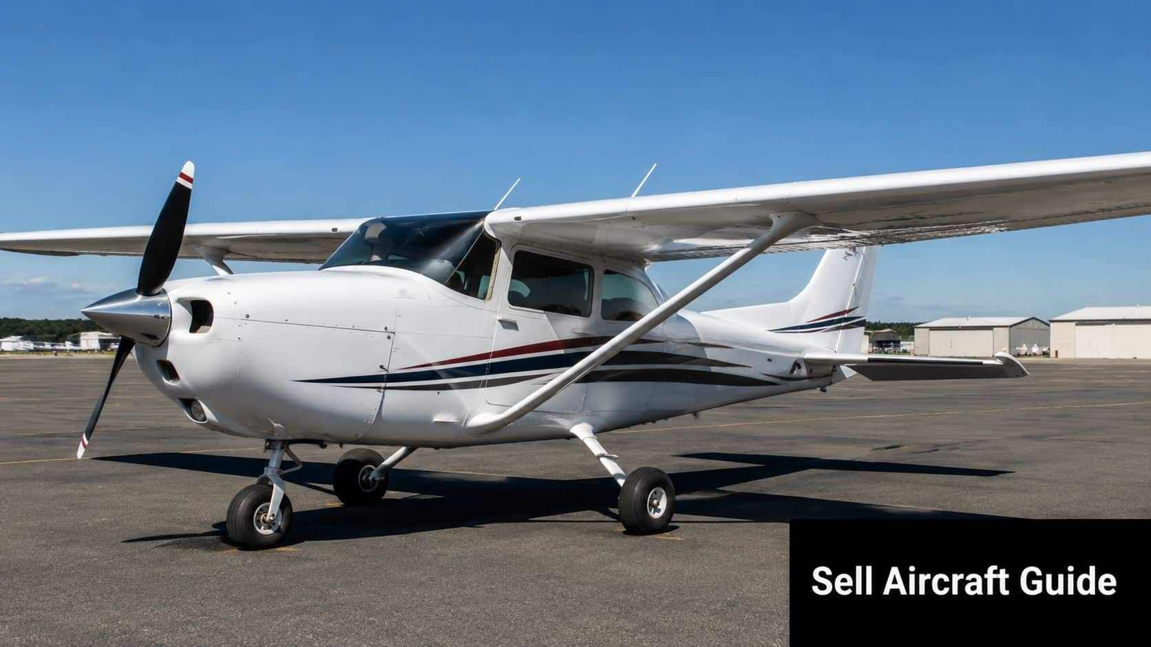 East Hill Flying Club: A Complete Pilot's Guide for 2026 5 A white Cessna light aircraft parked on an airport tarmac against a clear blue sky background.