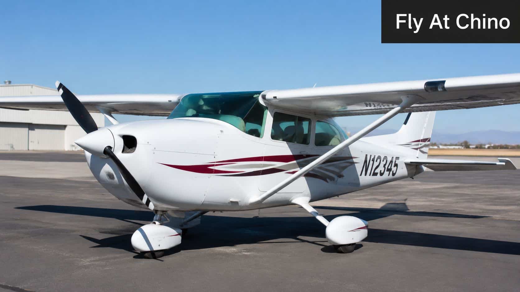 Private Pilot License Renewal: 2026 FAA Flight Review Guide 4 A small white Cessna private aircraft parked on an airport tarmac under a clear blue sky.