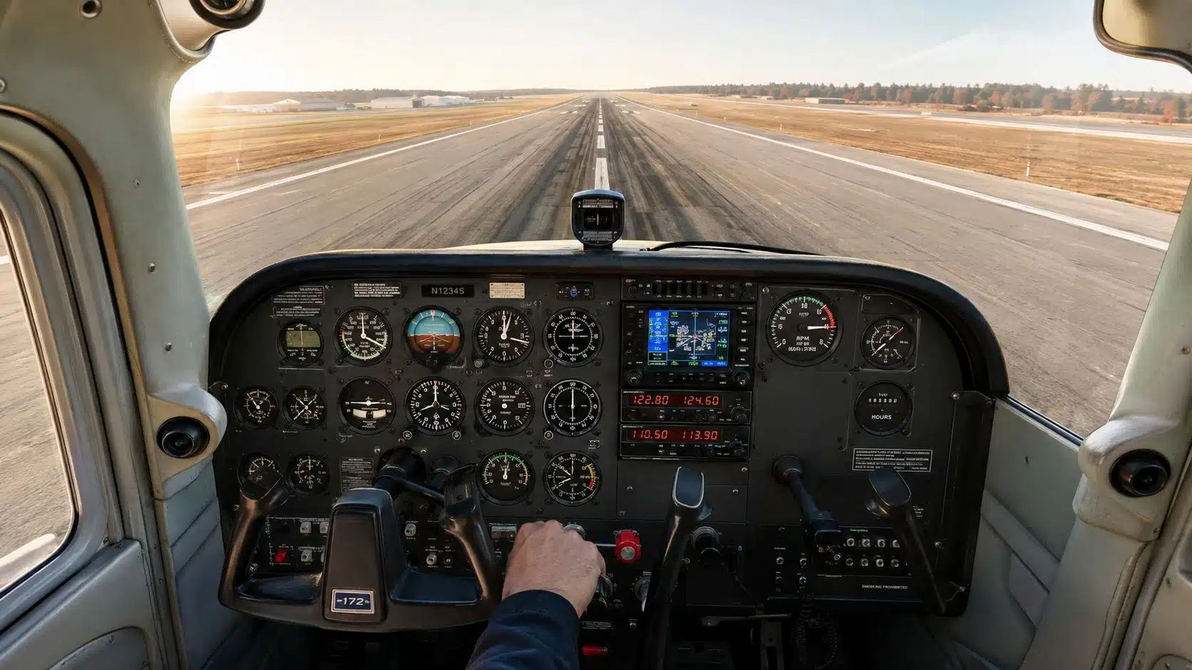 Engine Failure Procedures Every Pilot Should Master 2 A pilot's view from the cockpit of a Cessna 172 aircraft aligning with the airport runway.